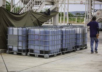 Methanol tank white or chemical drums stacked up the industry.